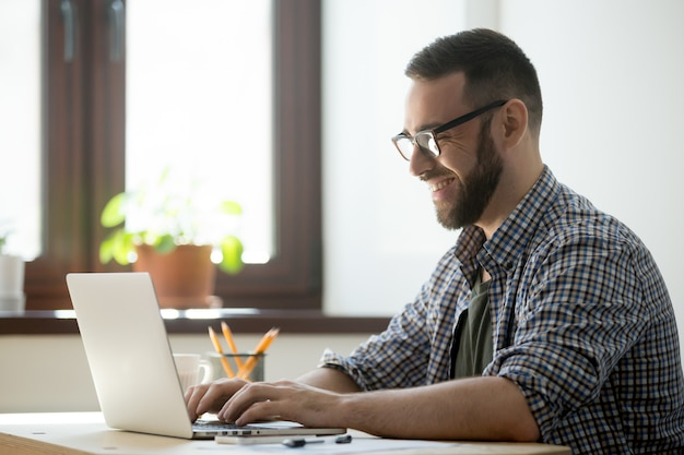 A person uses a laptop at work.